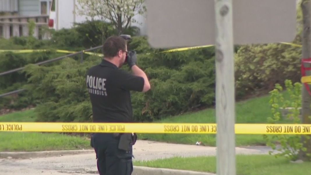 Milwaukee armored truck robbery, shootout; suspect shot, killed by guard
